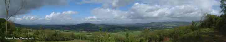 Panoramic view over Monmouth (to the right) with the 
		Abergavenny Sugar Loaf in the distance