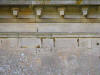 Close-up photograph of the damaged masonry